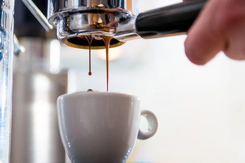 Cup of coffee being poured